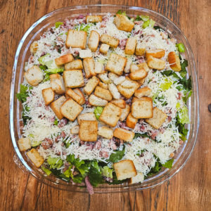 Salad Caesar Catering Bowl (crisp romaine, bacon, grated parmesan & croutons with our creamy Caesar dressing)