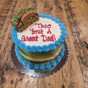 Taco 'Bout A Great Dad Cake (6" serves 4-6, vanilla cake, vanilla buttercream icing, caramel filling)